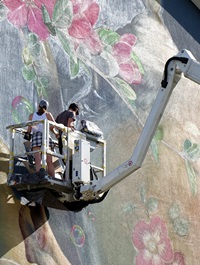 Natalia with her husband, who assists her with rough work.Natalia with her husband, who assists her with rough work