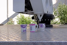 Enormous coffee machine... But three cups?? The third is perhaps for a visitor?