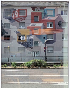 Reflection in a large window of the shopping centre opposite